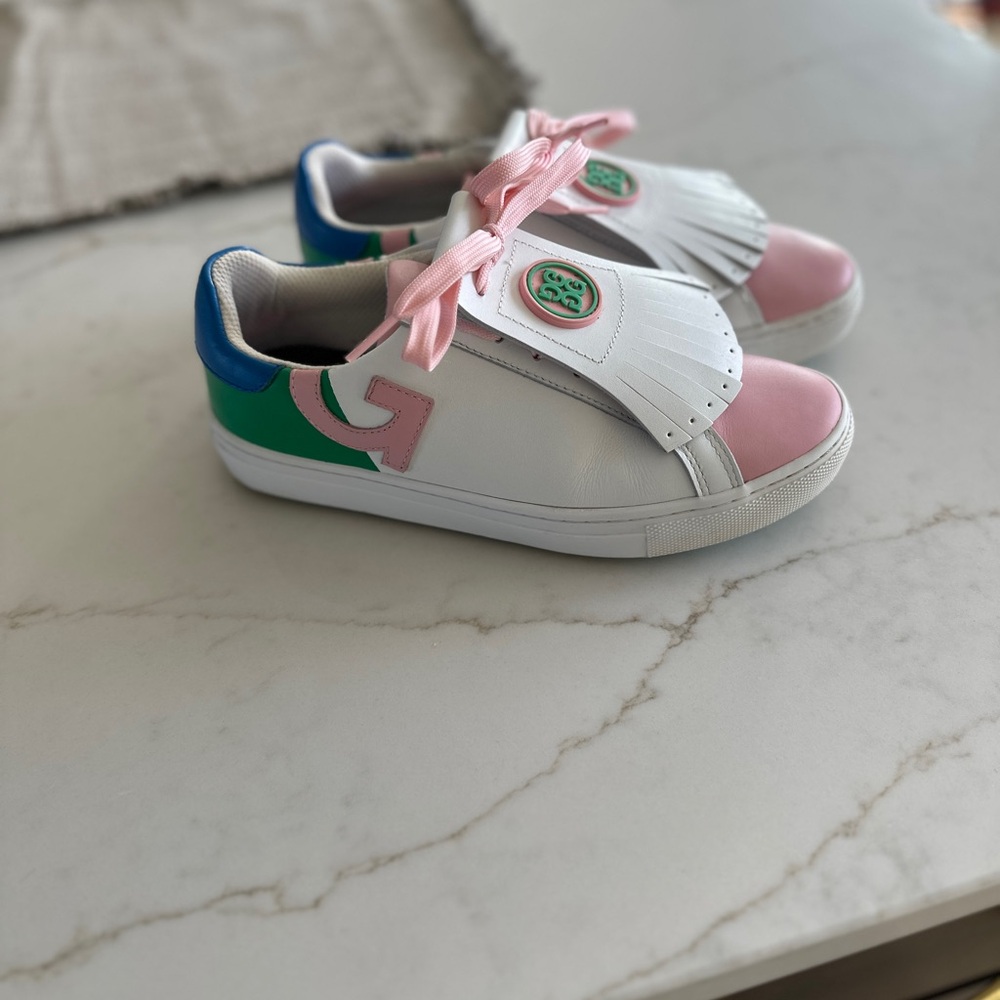 G/FORE Kiltie Disrupt Pink, White, and Green Golf Shoes.